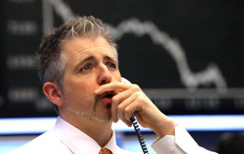 German stock exchange, stock market crash. A trader reacts after the news of 