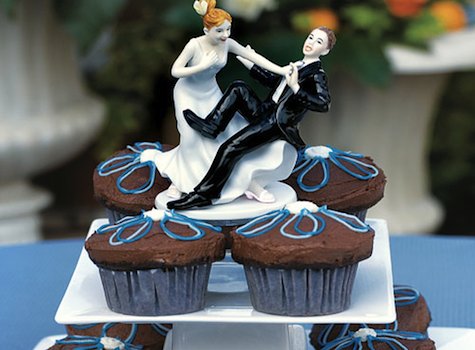 cool wedding cake topper How much you'll spend on your wedding is dictated